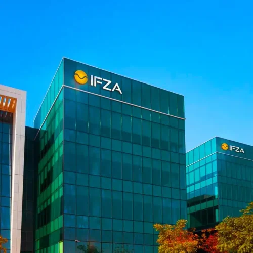 IFZA building, a prominent location for business setup in Dubai, reflecting the architectural style typical of Dubai Airport Freezone. This facility is ideal for company formation and obtaining trading licenses in Dubai, catering to various trading companies and other activities listed for free zones.
